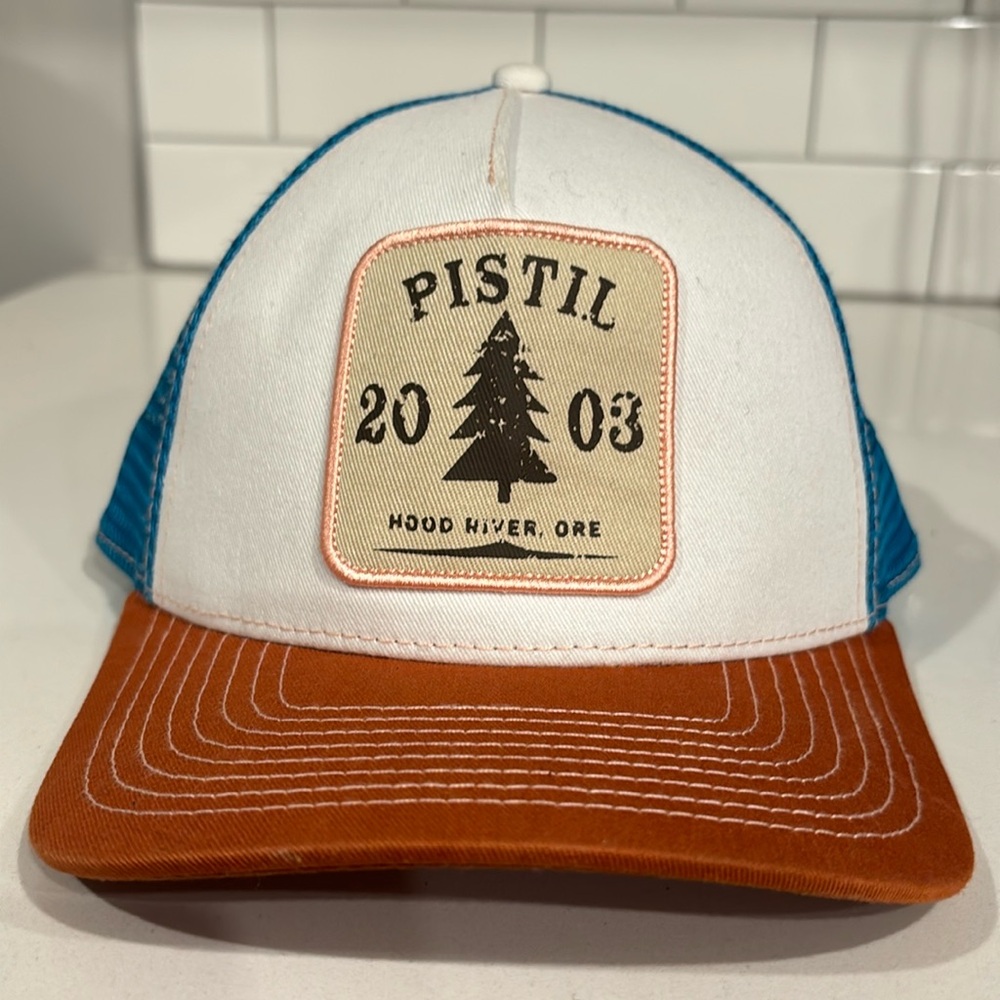 Ladies Multi Color Pistil Adjustable Trucker Hat. Worn for photo shoot.